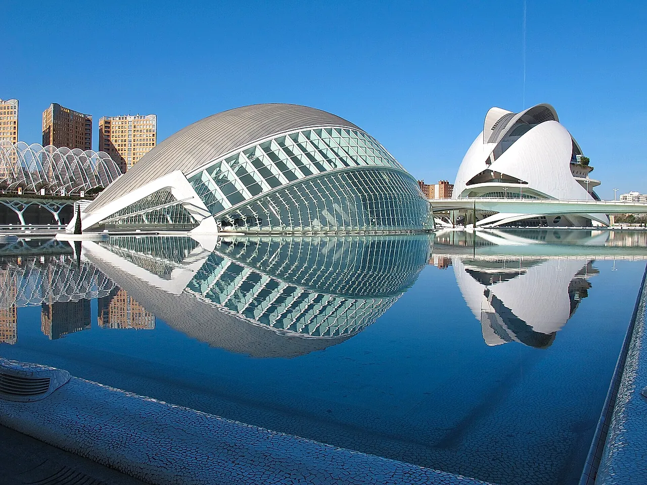 The Hemisfèric and the Palau de les Arts reflected in the water of the City of Arts and Sciences